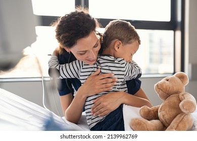 Nurse Hugging Sick Little Boy Patient In Hospital Young Medical Practitioner Embracing Upset Kid In Clinic Lovely Doctor Taking Care Of Cute Child At Private Clinic Gratitude And Healthcare Concept