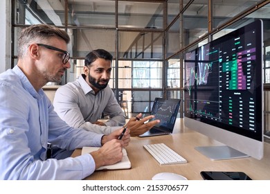 Two Diverse Crypto Traders Brokers Stock Exchange Market Investors Discussing Trading Charts Research Reports Growth Using Pc Computer Looking At Screen Analyzing Invest Strategy Financial Risks