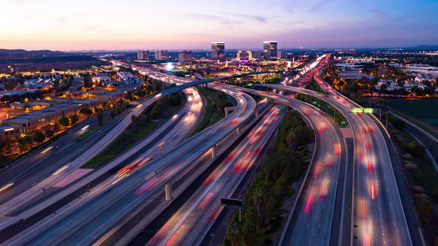 Aerial Hyperlapse Drone Shot Of Fast Moving Freeway Traffic At Night Showing Cars And Light Streaks