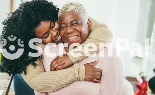 African Daughter Hugging Her Mum Indoors At Home   Main Focus On Senior Mother Face   Mom Day And Family Love Concept