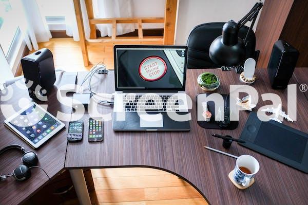 Black And White Laptop Computer On Brown Wooden Desk