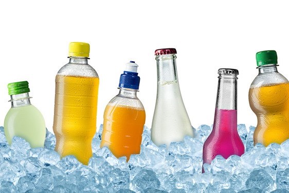 Range of colorful soft drinks on crushed ice