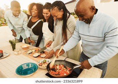 Happy African Family Cooking Outdoor At Home Rooftop Terrace During Summer Time   Sunday Dinner Community Concept   Focus On Mother Face