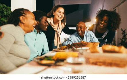 Happy African People Eating Dinner Together At Home Terrace Outdoor   Holidays And Family Concept   Soft Focus On Senior Woman Face