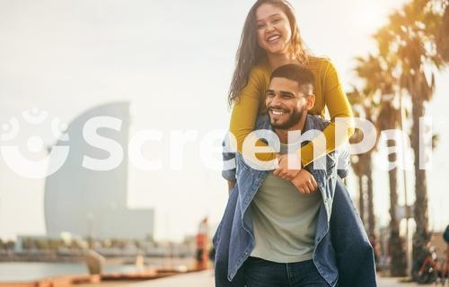 Happy Couple Having Fun Walking In Barcelona During Travel Vacations   Soft Focus On Man Face