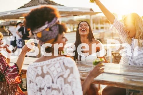 Happy Girls Having Fun Drinking Cocktails At Bar On The Beach   Party And Summer Concept   Focus On Latin Girl Face