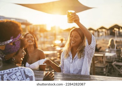 Happy Girls Having Fun Drinking Cocktails At Bar On The Beach   Soft Focus On African Girl Face