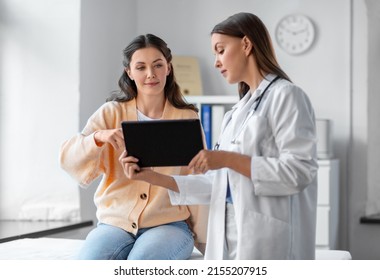 Medicine Healthcare And People Concept   Female Doctor With Tablet Pc Computer Talking To Woman Patient At Hospital