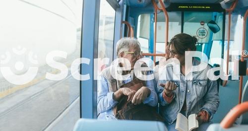 Senior Man And Mature Woman Talking Together While Traveling With Tram Transportation   Soft Focus On Man Face